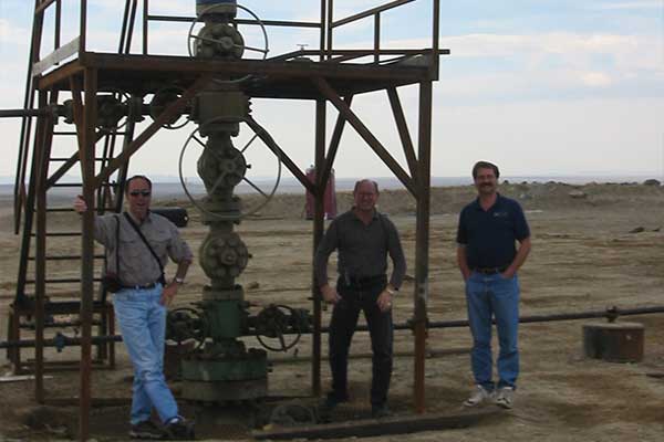 3 Men Standing Around Drill